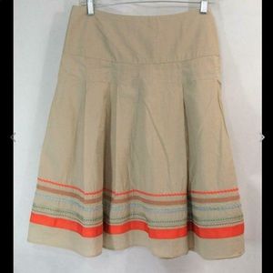 Ribbon trimmed skirt.